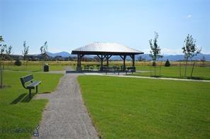 view of community featuring a mountain view, a gazebo, and a lawn