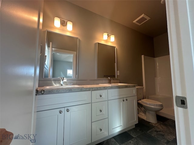 bathroom with toilet, walk in shower, and vanity