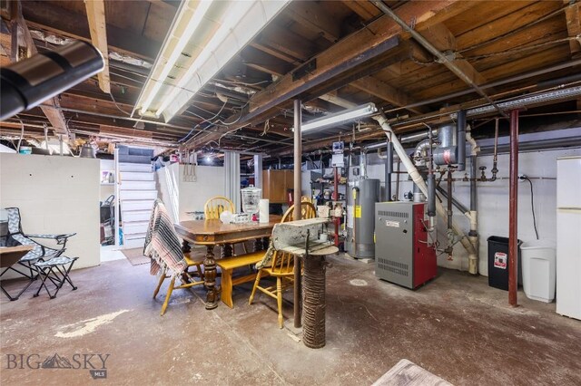 413 E 4th St, Anaconda, MT 59711 - basement featuring gas water heater and white fridge