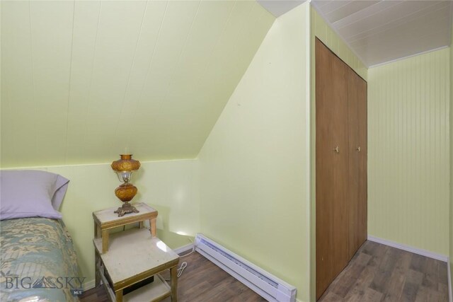 413 E 4th St, Anaconda, MT 59711 - bedroom with baseboard heating and dark wood-type flooring
