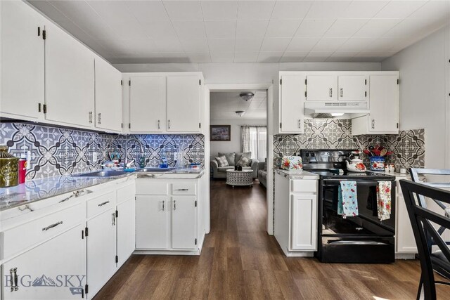 413 E 4th St, Anaconda, MT 59711 - kitchen with dark hardwood / wood-style flooring, white cabinetry, and black electric range oven