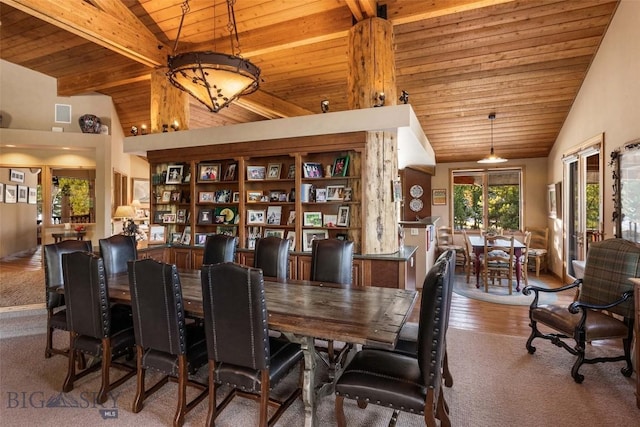 dining space with beamed ceiling, high vaulted ceiling, and wooden ceiling