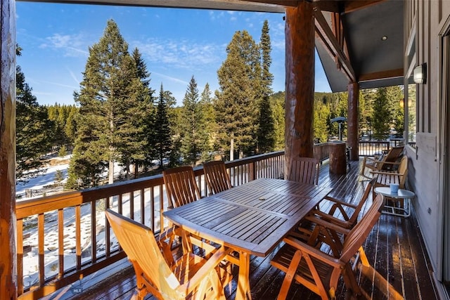 deck with outdoor dining space