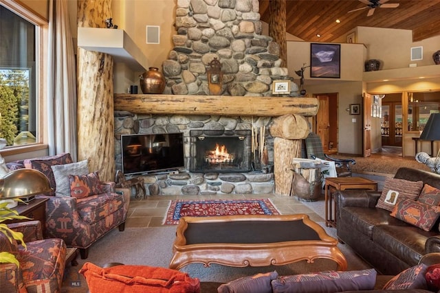 living room featuring a stone fireplace, wood ceiling, visible vents, and high vaulted ceiling