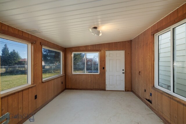 unfurnished sunroom with lofted ceiling