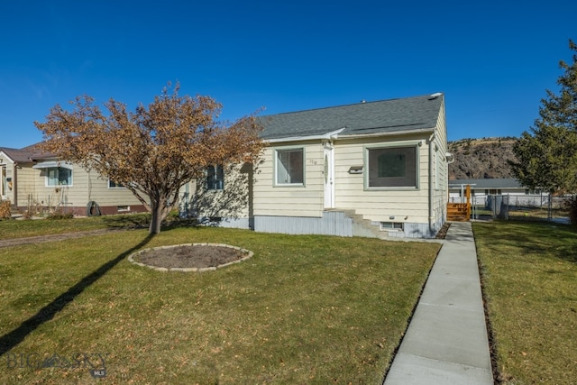 view of front of home with a front lawn