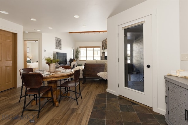 dining area featuring dark hardwood / wood-style flooring