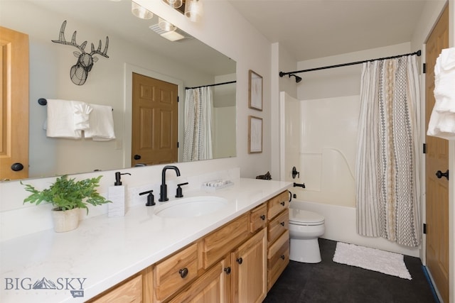 full bathroom featuring shower / bath combo with shower curtain, vanity, and toilet