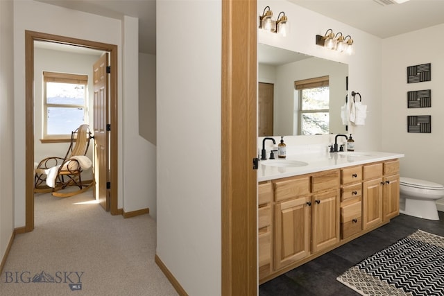 bathroom with vanity and toilet