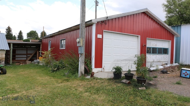 garage featuring a yard