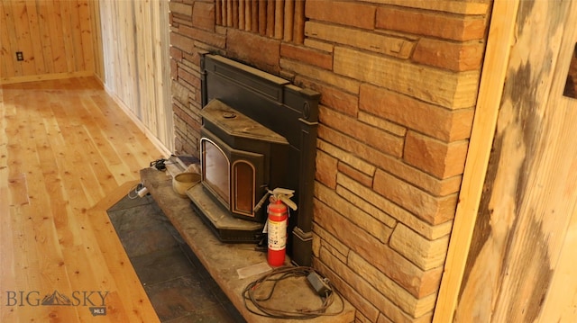 details with wood walls and hardwood / wood-style floors