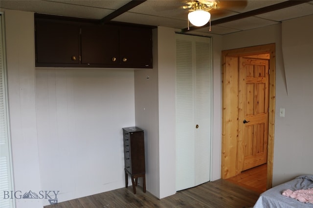 bedroom featuring ceiling fan and dark wood-type flooring