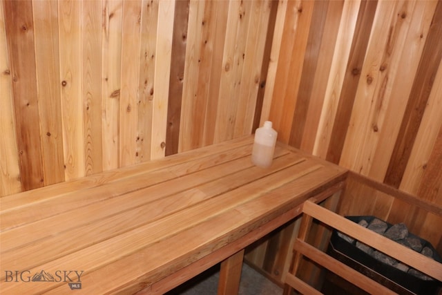 view of sauna / steam room featuring wooden walls