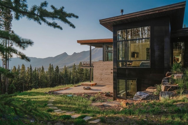 exterior space featuring a patio area and a mountain view