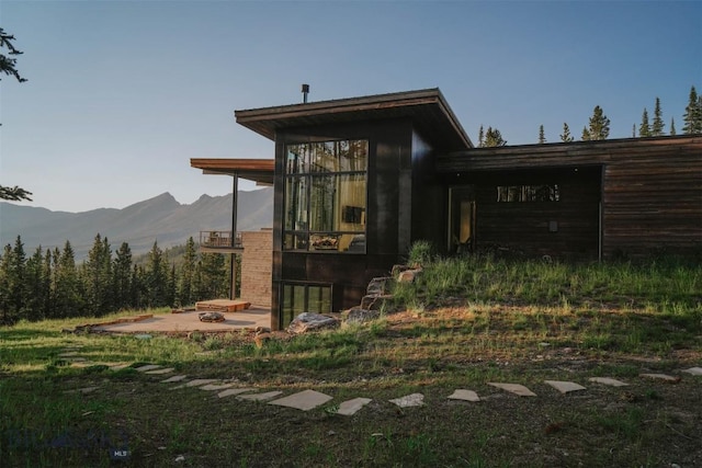 view of outbuilding with a mountain view