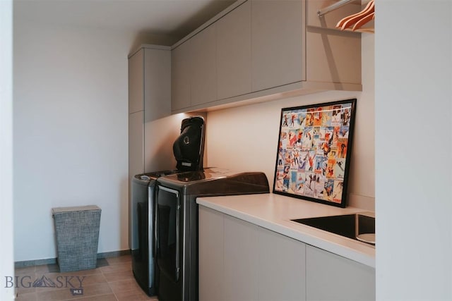 clothes washing area featuring cabinet space, independent washer and dryer, baseboards, and light tile patterned floors