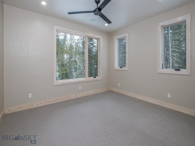 unfurnished room featuring carpet and ceiling fan