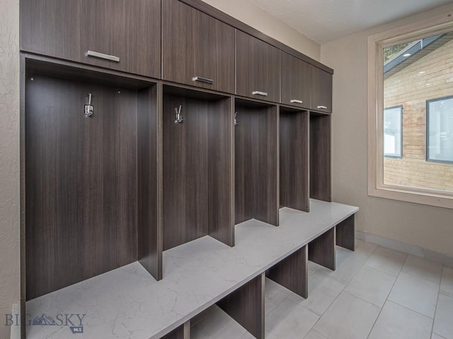 mudroom with light tile patterned flooring