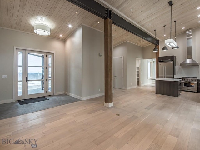 entrance foyer with light wood-type flooring and wood ceiling