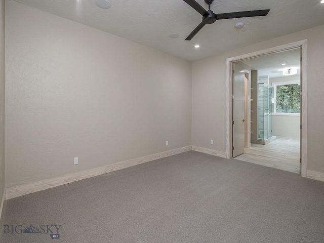 carpeted empty room with ceiling fan