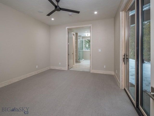 carpeted empty room with ceiling fan