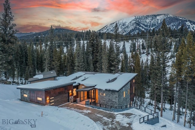 exterior space featuring a mountain view and a garage