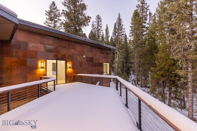 view of snow covered deck