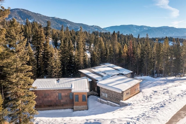 snowy aerial view featuring a mountain view