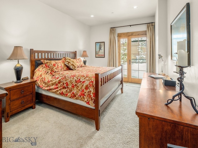 carpeted bedroom with access to outside and french doors