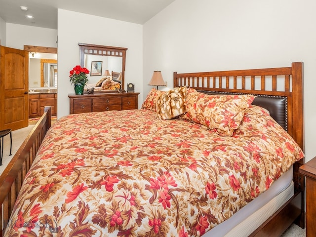 bedroom featuring carpet and ensuite bathroom