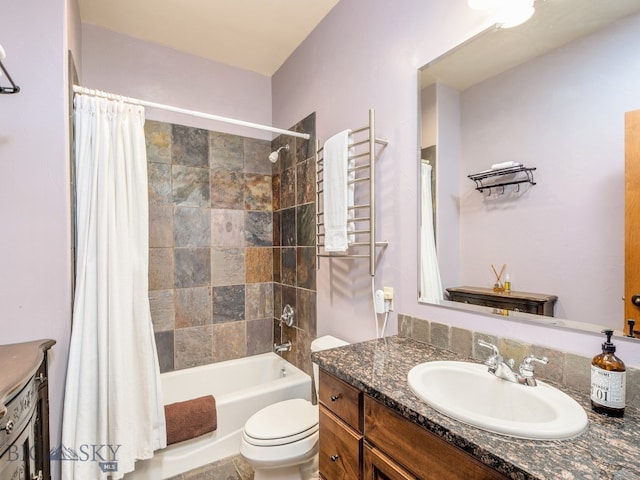 full bathroom featuring large vanity, shower / bath combo with shower curtain, and toilet