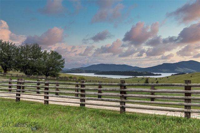 mountain view with a rural view and a water view