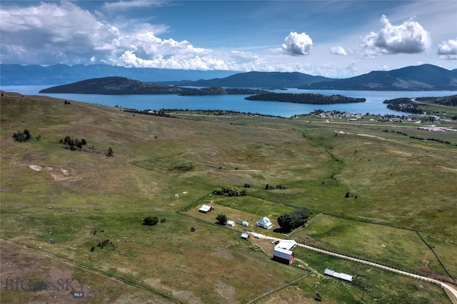 bird's eye view with a water and mountain view