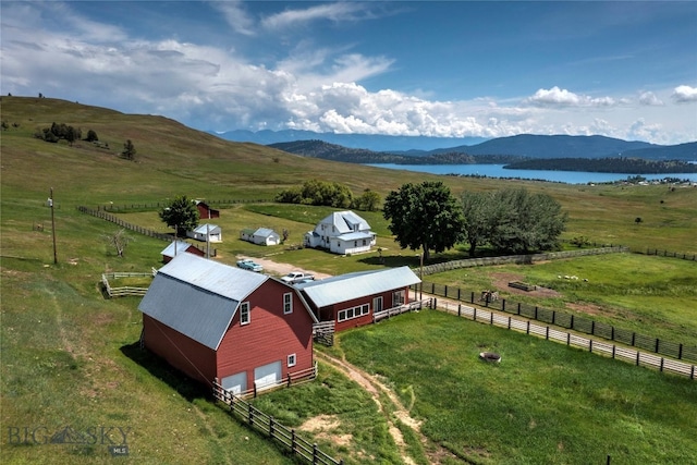 aerial view with a rural view and a water and mountain view