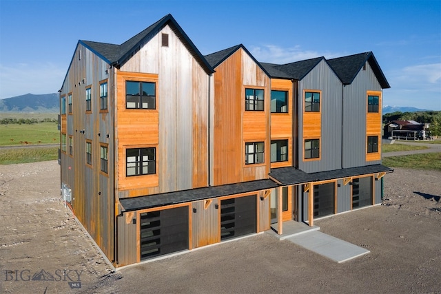 exterior space featuring a mountain view and a garage