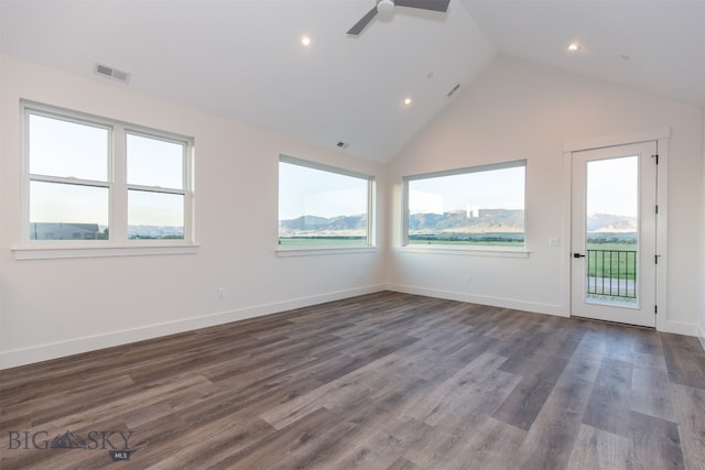 unfurnished living room featuring wood-type flooring, high vaulted ceiling, and ceiling fan