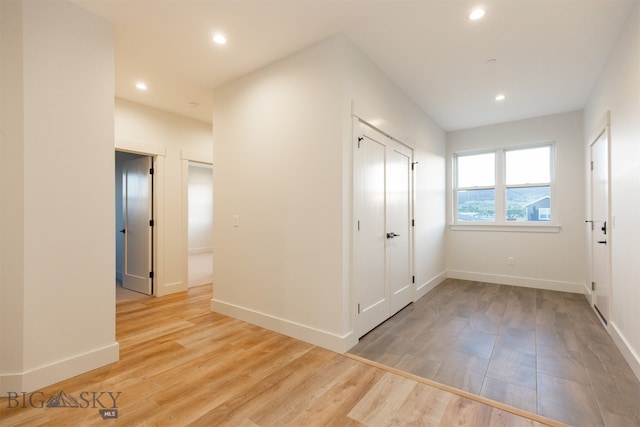 hall with light wood-type flooring