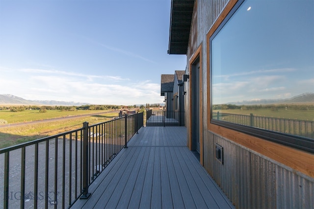 wooden deck featuring a rural view