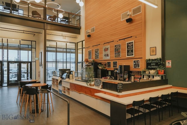 interior space featuring french doors and bar area