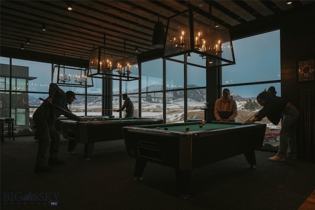 recreation room featuring a chandelier, billiards, a mountain view, and dark colored carpet