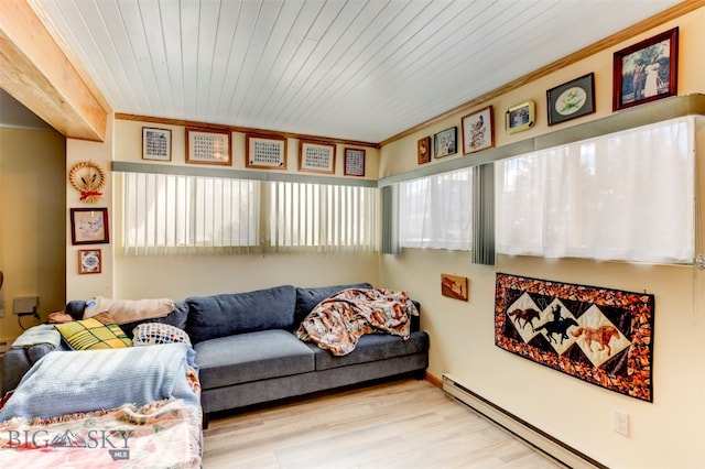 living room featuring wood ceiling, light wood-type flooring, a baseboard heating unit, and crown molding