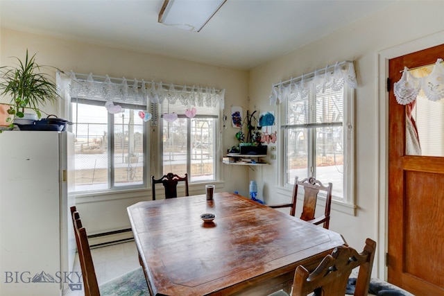 tiled dining area with baseboard heating