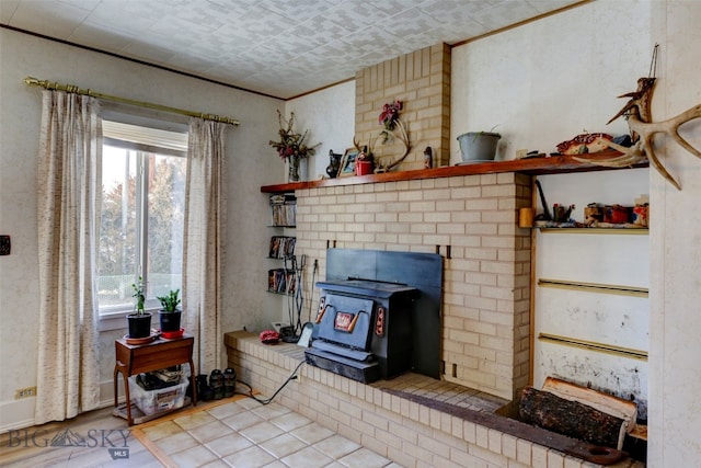 living room with a brick fireplace and light wood-type flooring