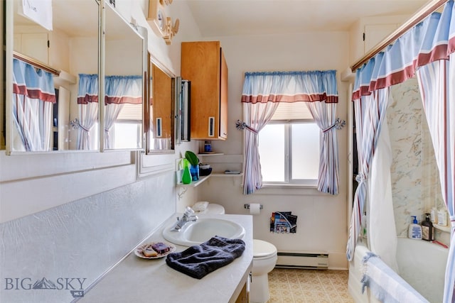 full bathroom featuring a baseboard radiator, a healthy amount of sunlight, vanity, and toilet