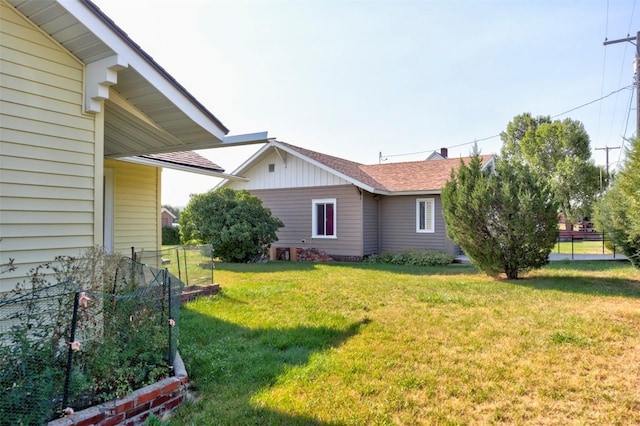 49 Two Dot Hwy, Harlowton, MT 59085 - view of property exterior with a lawn, roof with shingles, and fence