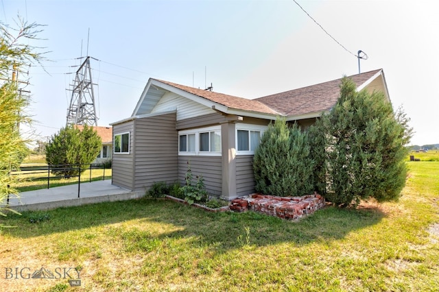 view of home's exterior with a lawn