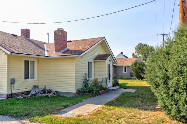 49 Two Dot Hwy, Harlowton, MT 59085 - exterior space featuring a yard, a chimney, and a shingled roof