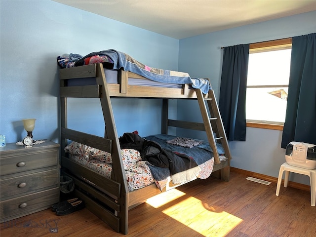 bedroom featuring dark wood-type flooring