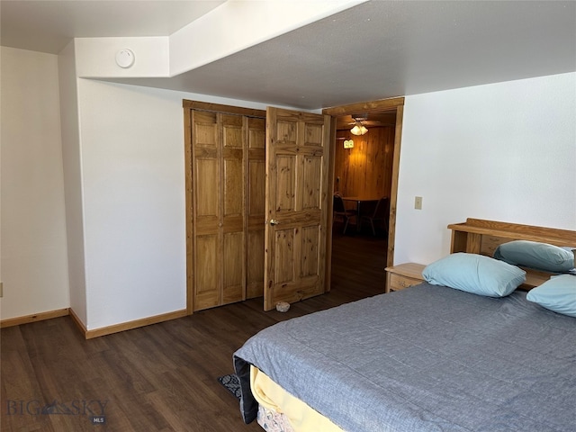 bedroom featuring dark wood-type flooring