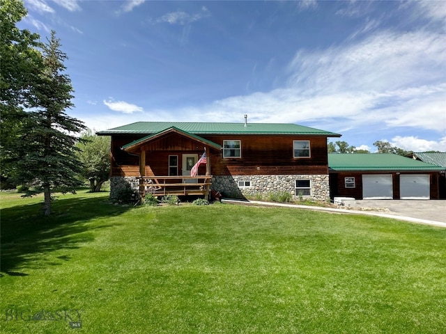 rear view of property featuring a yard